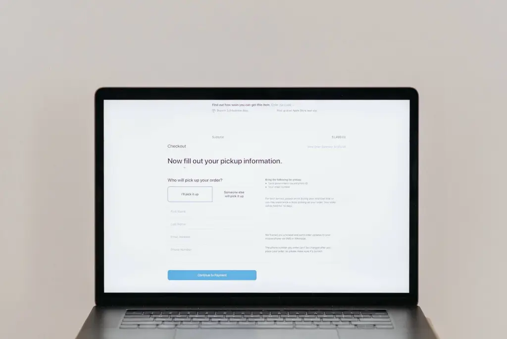 A laptop displaying an online checkout form, highlighting technology and e-commerce.